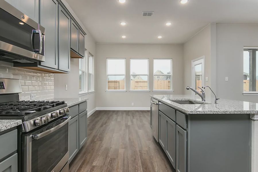 Representative furnished interior of a home built from the Finnigan by Chesmar Homes in Buffalo Crossing, Cibolo (Image 4).