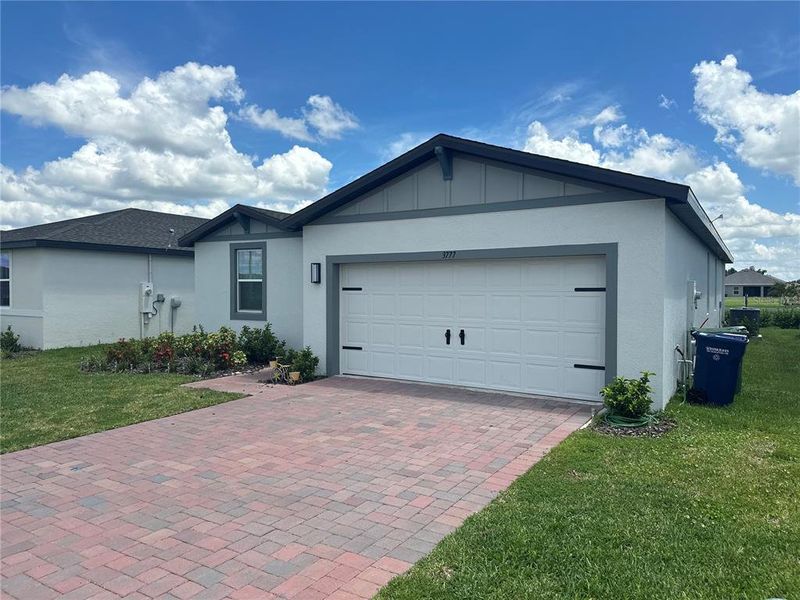 Front exterior of a new home in Villamar - Signature Series, Winter Haven, FL, highlighting curb appeal (Image 20).