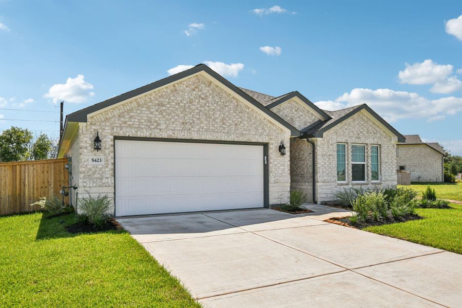Front exterior of a new home in Kingdom Heights, Rosenberg, TX, highlighting curb appeal (Image 2).