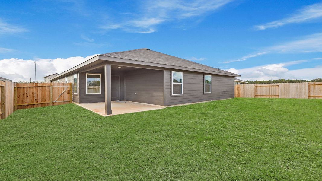 Exterior details and patio area of a home in Grand Pines, Magnolia (Image 4).