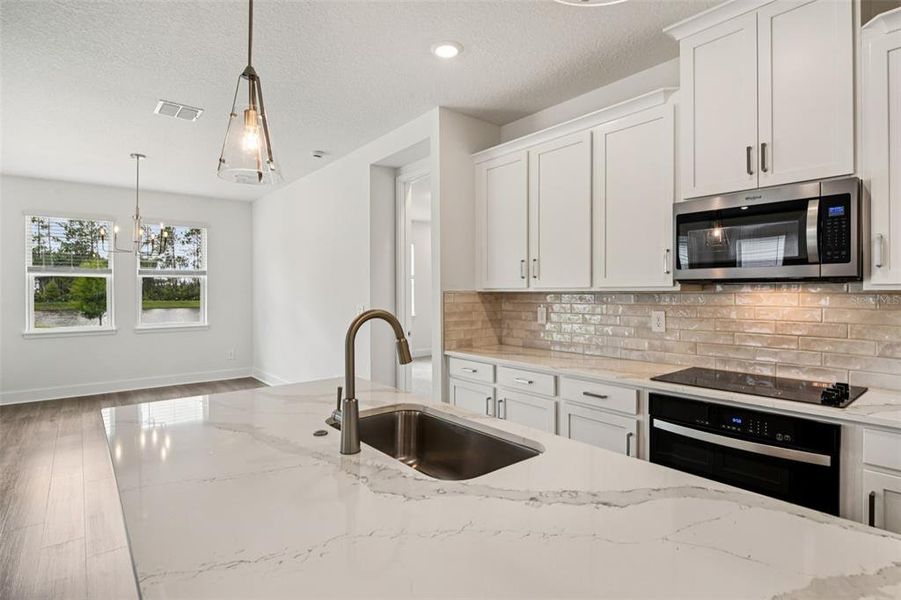 Furnished interior view inside a new home in Legends Preserve - Signature Series, Daytona Beach (Image 4).