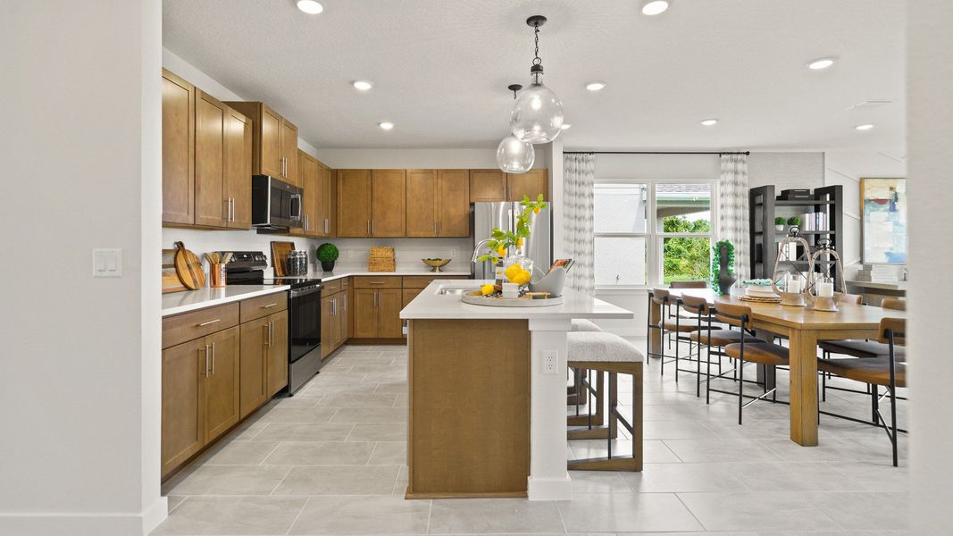 Castaway Kitchen and Dining Area, new home plan available at Liberty Trace in Haines City, fl