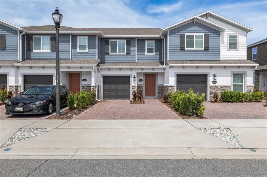 Front exterior of a new home in , Orlando, FL, highlighting curb appeal (Image 2). Front exterior of a new home in , Orlando, FL, highlighting curb appeal (Image 2).