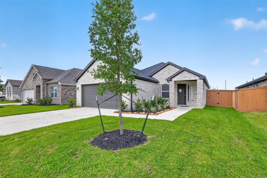 Front exterior of a new home in Cypress Green, Hockley, TX, highlighting curb appeal (Image 23).