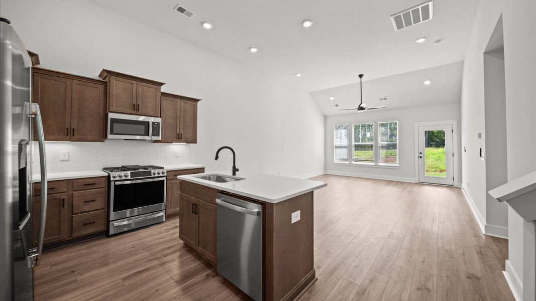 First-class finishes and a thoughtfully scaled island highlight this elegant kitchen space