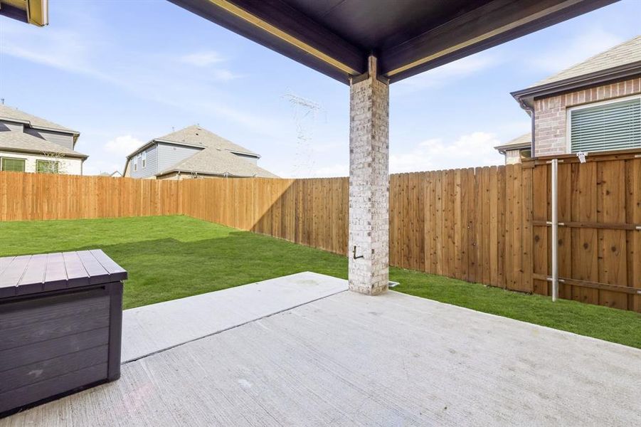 Exterior details and patio area of a home in The Villages of Hurricane Creek, Anna (Image 4).