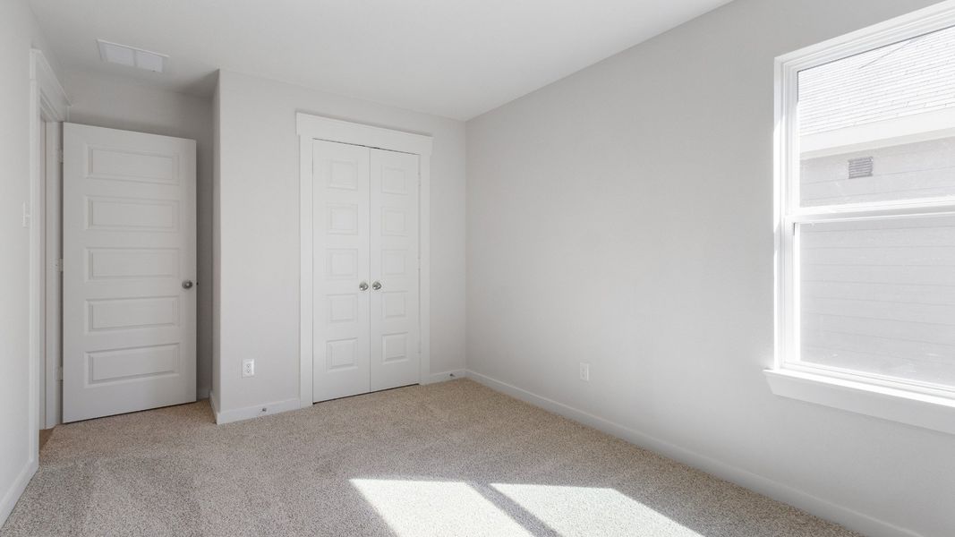 Representative furnished interior of a home built from the Blanton by Brightland Homes in Sunterra, Katy (Image 12).