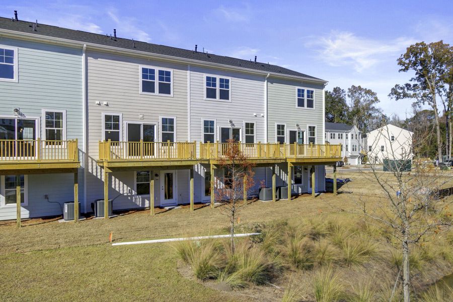 Exterior details and patio area of a home in , Johns Island (Image 25).