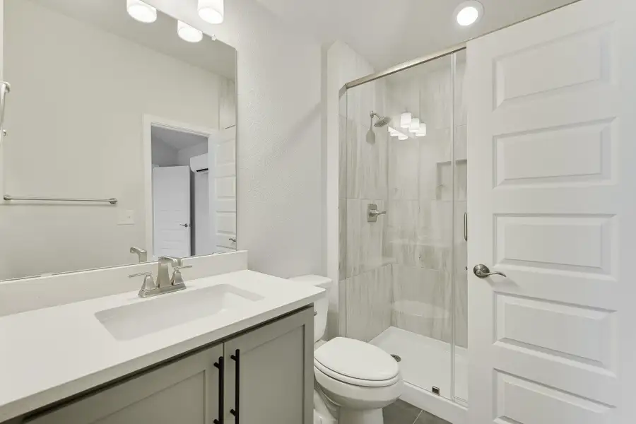 ADU Bathroom with a stall shower and vanity