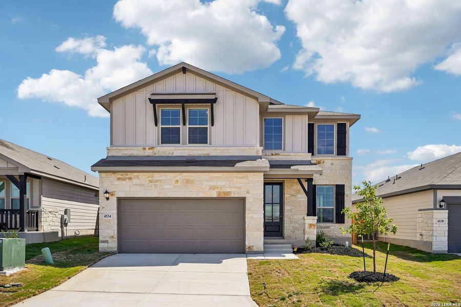 Front exterior of a new home in Remington Ranch, San Antonio, TX, highlighting curb appeal (Image 24). Front exterior of a new home in Remington Ranch, San Antonio, TX, highlighting curb appeal (Image 24).