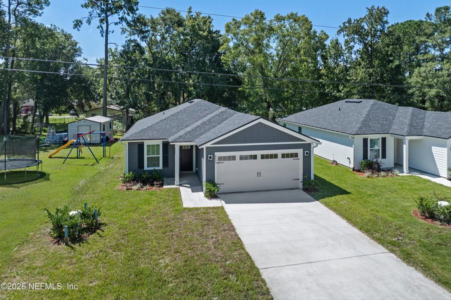 Front exterior of a new home in , Jacksonville, FL, highlighting curb appeal (Image 14).