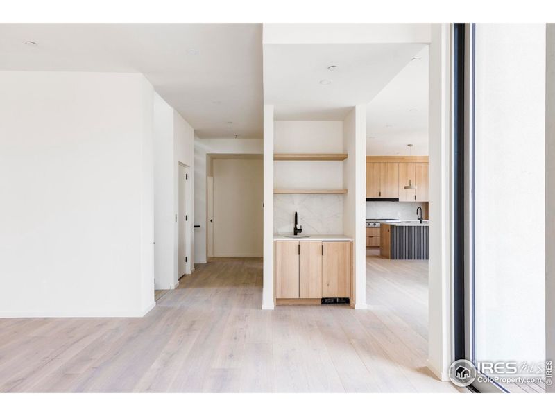 A chic wet bar with a beverage center and ice maker keeps refreshments close at hand.