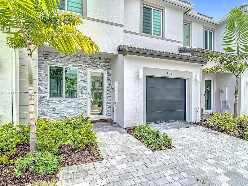 Front exterior of a new home in , Homestead, FL, highlighting curb appeal (Image 19). Front exterior of a new home in , Homestead, FL, highlighting curb appeal (Image 19).