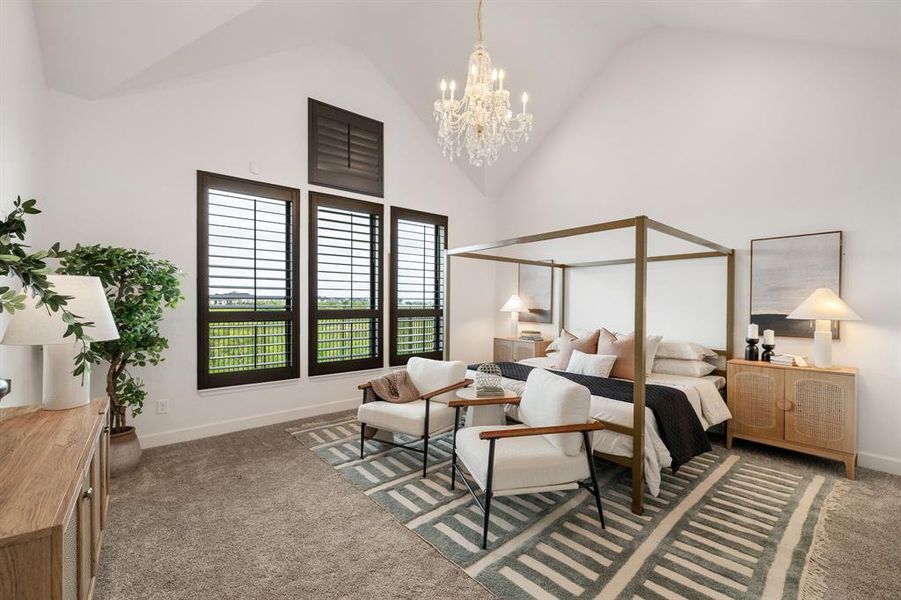 Carpeted bedroom with high vaulted ceiling and a chandelier Carpeted bedroom with high vaulted ceiling and a chandelier