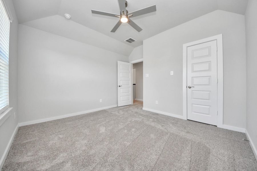 Generously sized secondary bedrooms featuring spacious closets, soft and inviting carpeting underfoot, large windows allowing plenty of natural light, and the added touch of privacy blinds for your personal retreat.