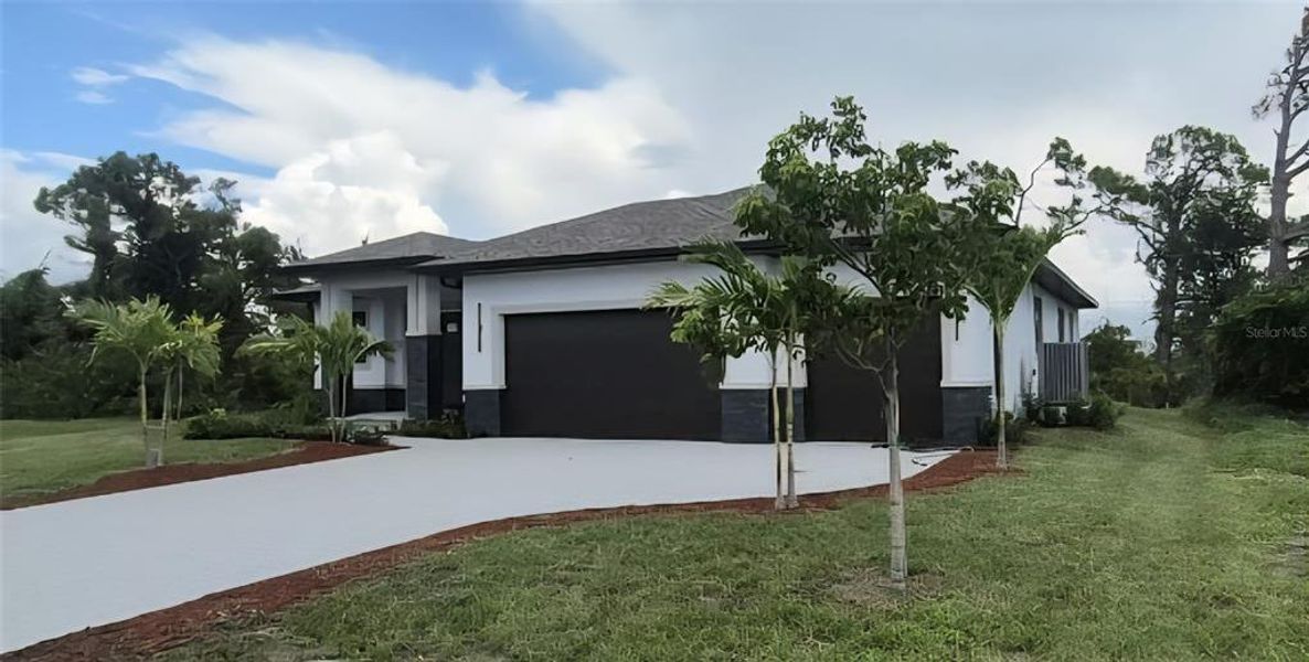 Front exterior of a new home in , Placida, FL, highlighting curb appeal (Image 7).