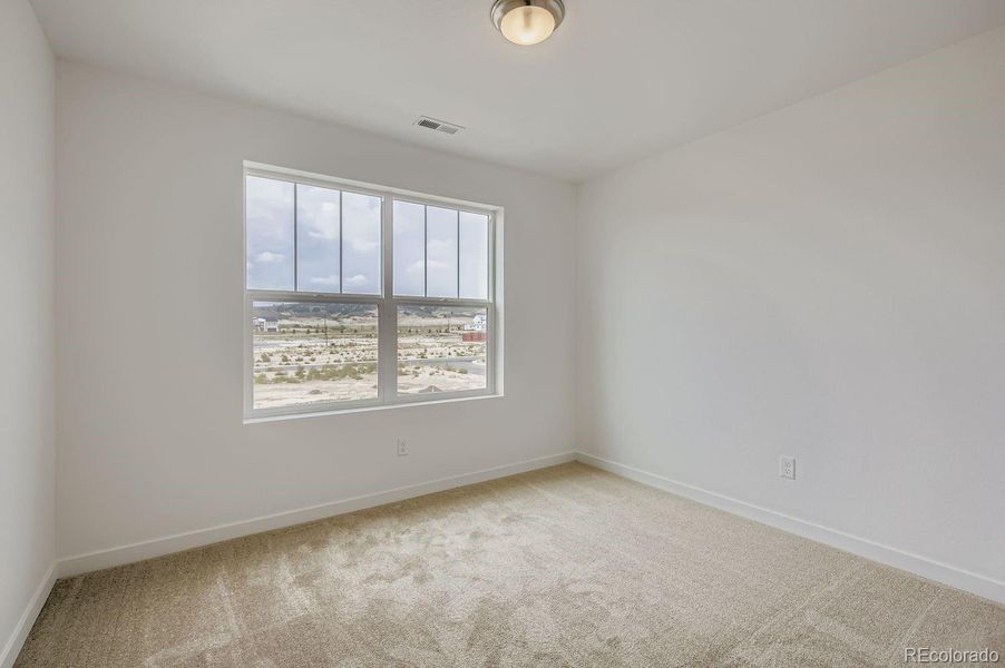 Spacious, unfurnished interior of a new home in Riano Ridge: The Pioneer Collection, Loveland (Image 9).