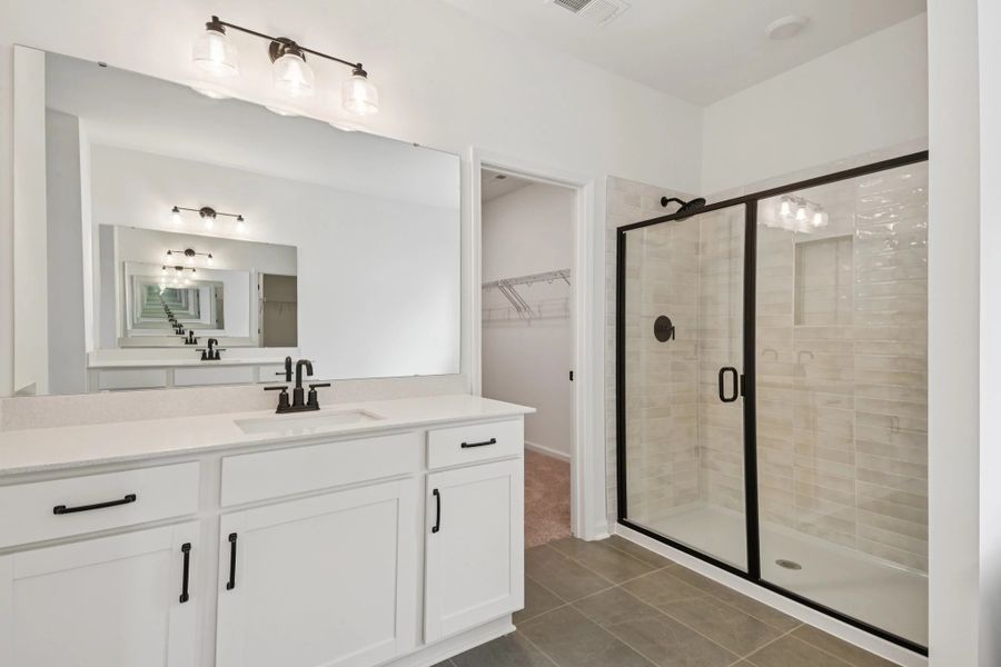 Primary Bath featuring the AW Collection® Rosemary - Organic textures meet bold design. Primary Bath featuring the AW Collection® Rosemary - Organic textures meet bold design.