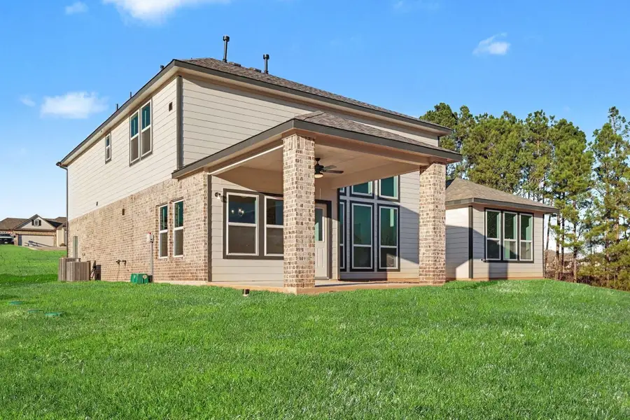 Exterior details and patio area of a home in Rose Hill Estates, Willis (Image 4).