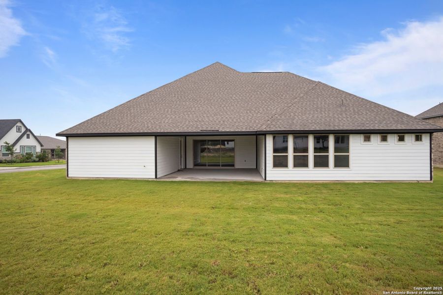 Front exterior of a new home in Potranco Oaks, Castroville, TX, highlighting curb appeal (Image 64).
