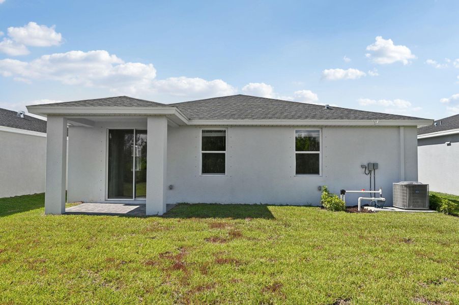 Front exterior of a new home in Hampton Park - Classic Series, Vero Beach, FL, highlighting curb appeal (Image 2). Front exterior of a new home in Hampton Park - Classic Series, Vero Beach, FL, highlighting curb appeal (Image 2).