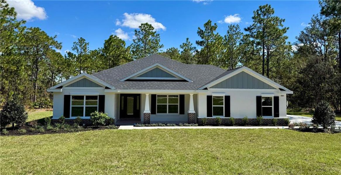 Front exterior of a new home in , Dunnellon, FL, highlighting curb appeal (Image 1). Front exterior of a new home in , Dunnellon, FL, highlighting curb appeal (Image 1).