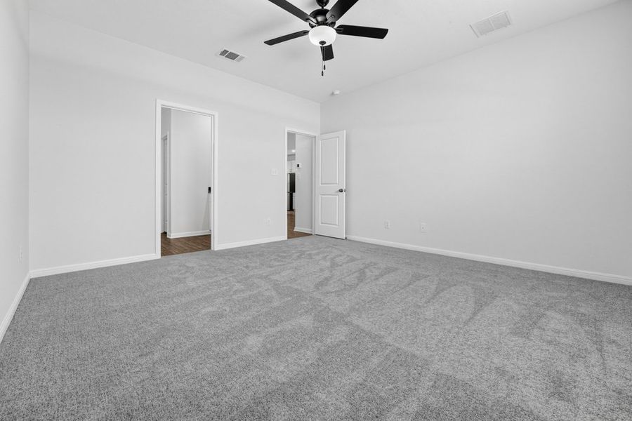 Representative unfurnished interior of a home built from the Pheasant by Taylor Morrison in Emory Crossing, Hutto (Image 11).