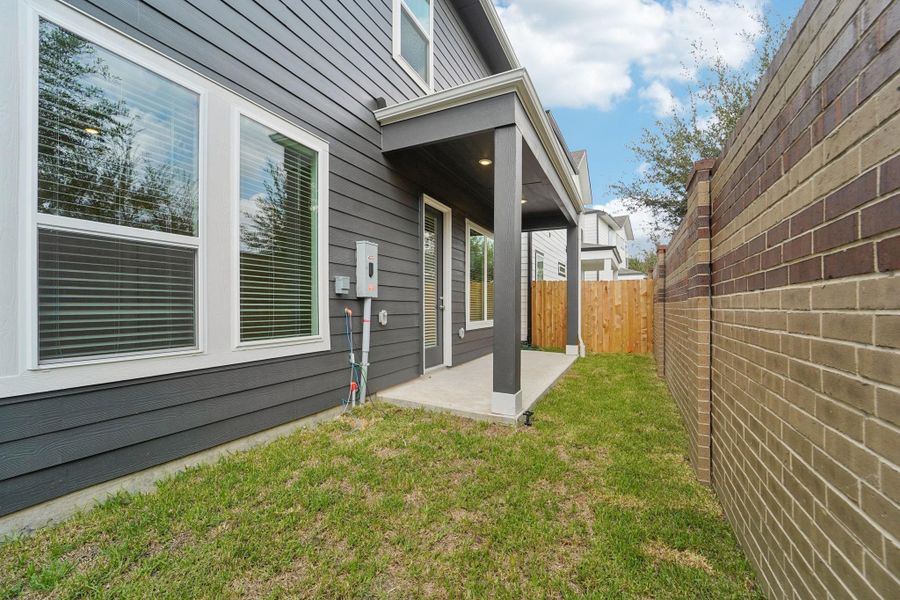 Front exterior of a new home in Spring Brook Village - Luxe Series, Houston, TX, highlighting curb appeal (Image 1). Front exterior of a new home in Spring Brook Village - Luxe Series, Houston, TX, highlighting curb appeal (Image 1).