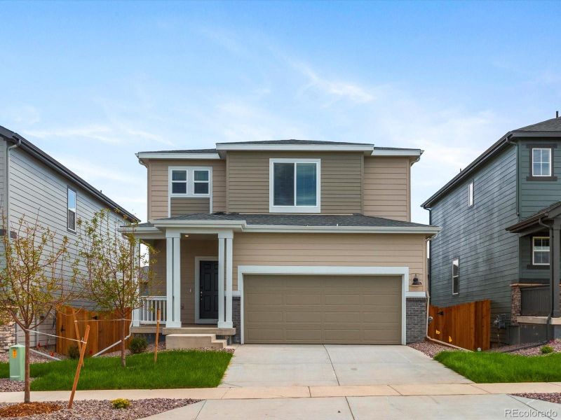 Front exterior of a new home in Lake Bluff, Greeley, CO, highlighting curb appeal (Image 15). Front exterior of a new home in Lake Bluff, Greeley, CO, highlighting curb appeal (Image 15).
