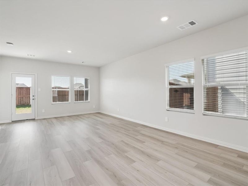 Spare room featuring light wood-type flooring and recessed lighting