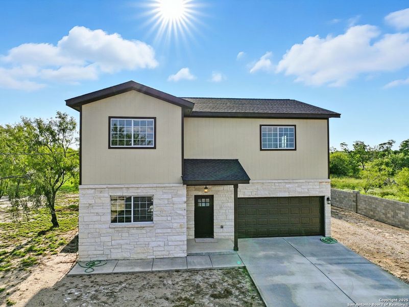 Front exterior of a new home in , Lytle, TX, highlighting curb appeal (Image 24). Front exterior of a new home in , Lytle, TX, highlighting curb appeal (Image 24).