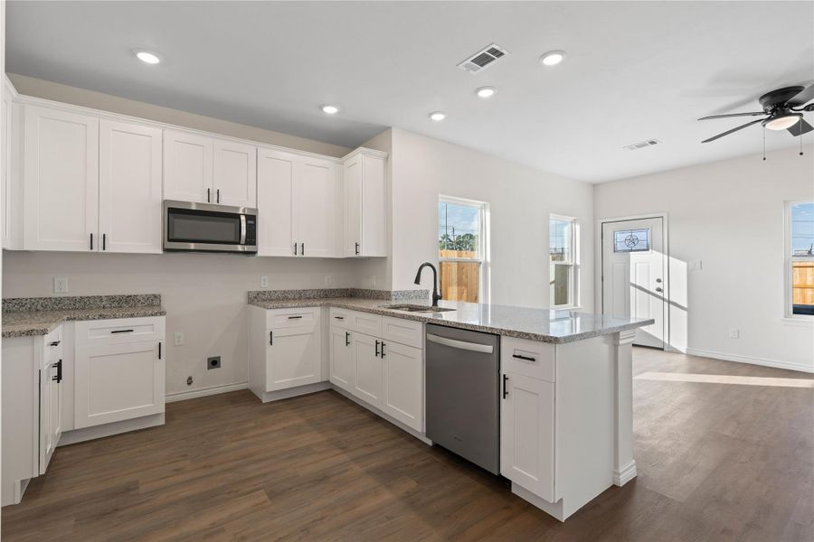 Designed for connection, the kitchen offers an open layout with generous counter space, ideal for cooking, gathering, and entertaining with ease.