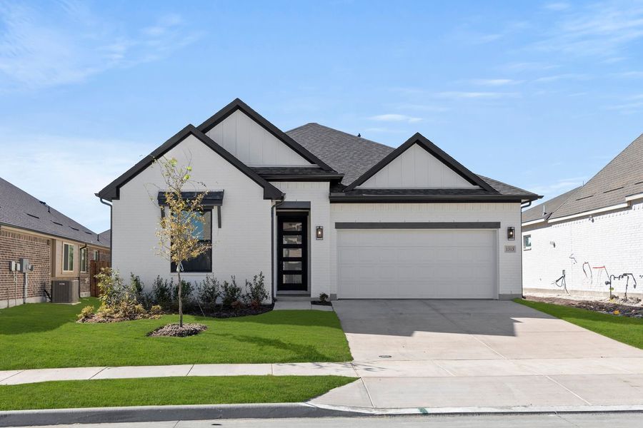 Front exterior of a new home in West Crossing, Anna, TX, highlighting curb appeal (Image 1).
