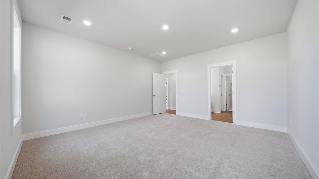 Elegant and functional primary suite in our reputable Creeks at Midway community