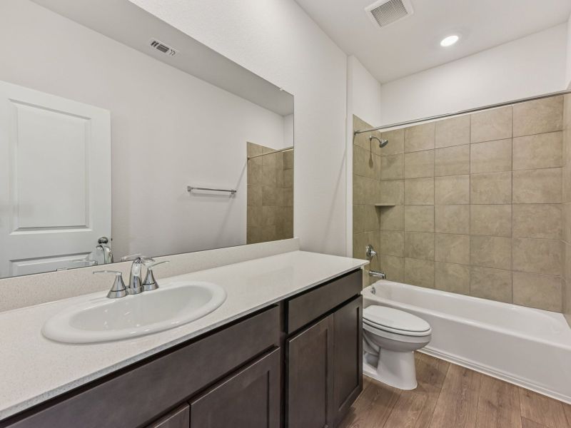 Furnished interior view inside a new home in Riverbend at Double Eagle - Reserve Collection, Cedar Creek (Image 7).