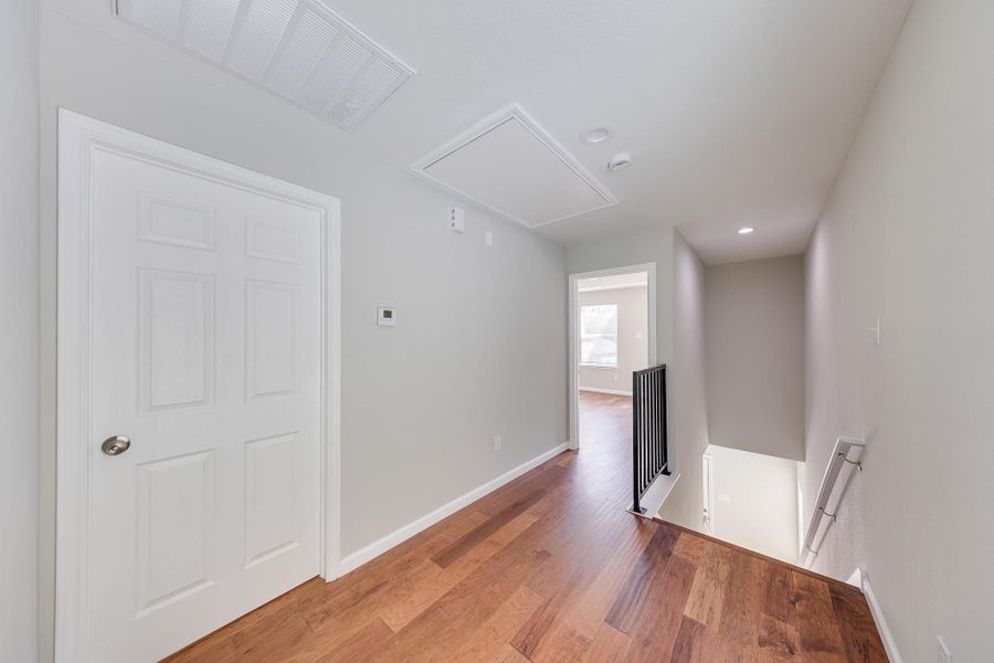 The bright, transitional hallway to the second floor creates a smooth flow between your living areas and private upstairs retreats.