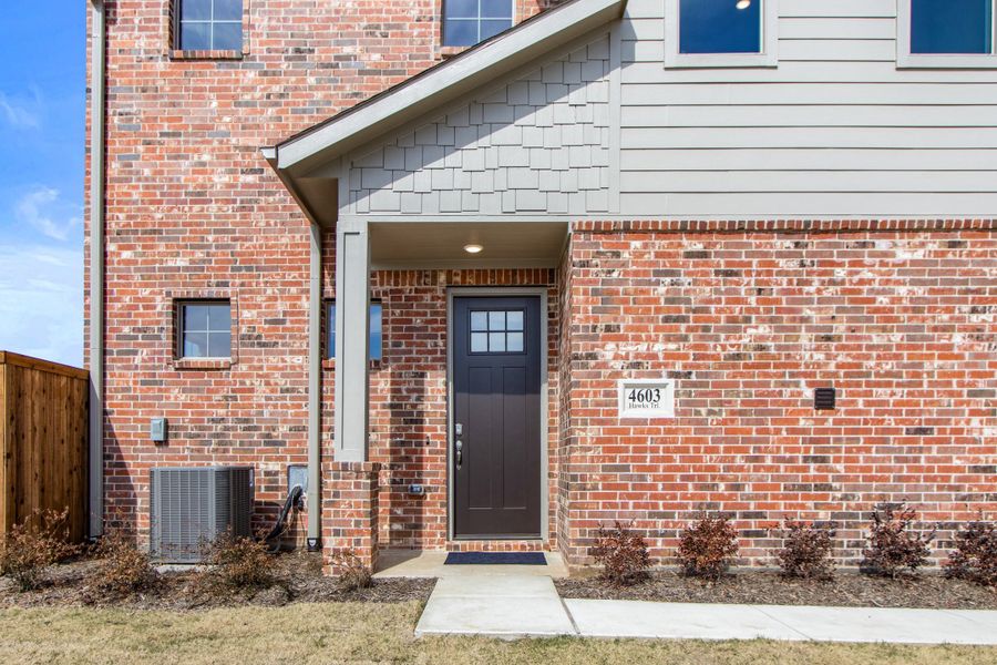 Exterior details and patio area of a home in Wildridge, Oak Point (Image 3).