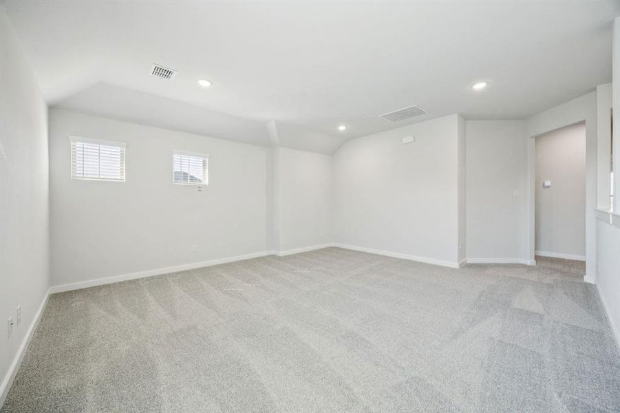 Game room in the Masters home plan by Trophy Signature Homes – REPRESENTATIVE PHOTO