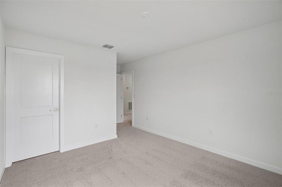 Spacious, unfurnished interior of a new home in Grasslands West, Lakeland (Image 36).
