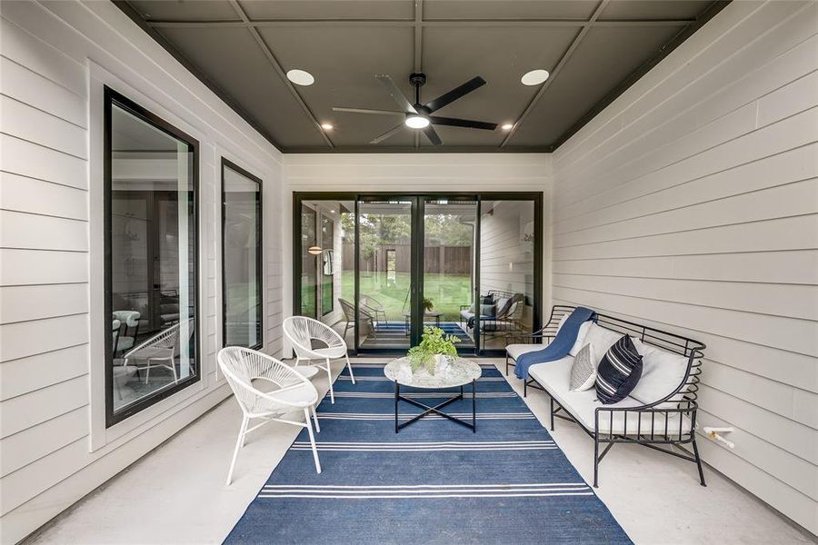 View of patio / terrace with ceiling fan and an outdoor living space View of patio / terrace with ceiling fan and an outdoor living space