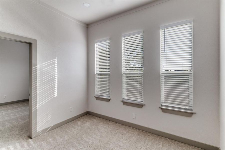 Unfurnished room featuring light carpet and baseboards Unfurnished room featuring light carpet and baseboards