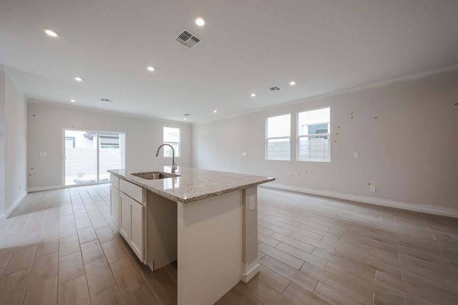 A kitchen with white cabinets. A kitchen with white cabinets.