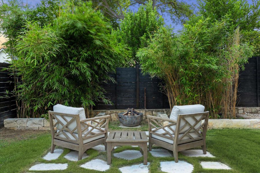 View of patio / terrace with an outdoor fire pit View of patio / terrace with an outdoor fire pit