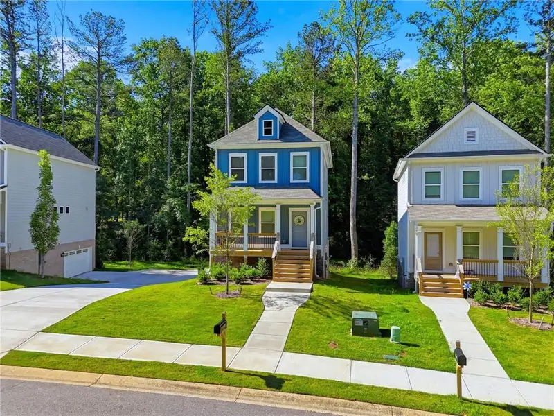 Front exterior of a new home in , Woodstock, GA, highlighting curb appeal (Image 24). Front exterior of a new home in , Woodstock, GA, highlighting curb appeal (Image 24).