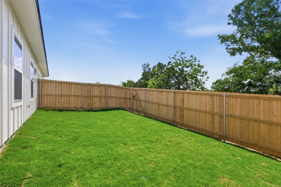 View of fenced backyard