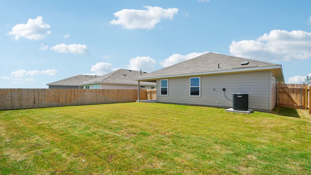 Exterior details and patio area of a home in Carillon, Manor (Image 22).