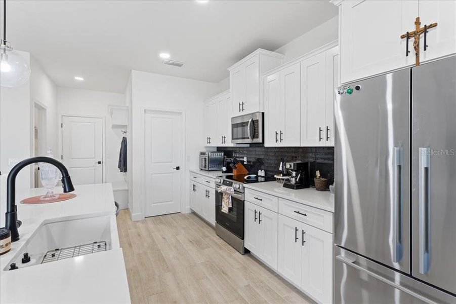 Furnished interior view inside a new home in Grand Oaks, Gainesville (Image 11).