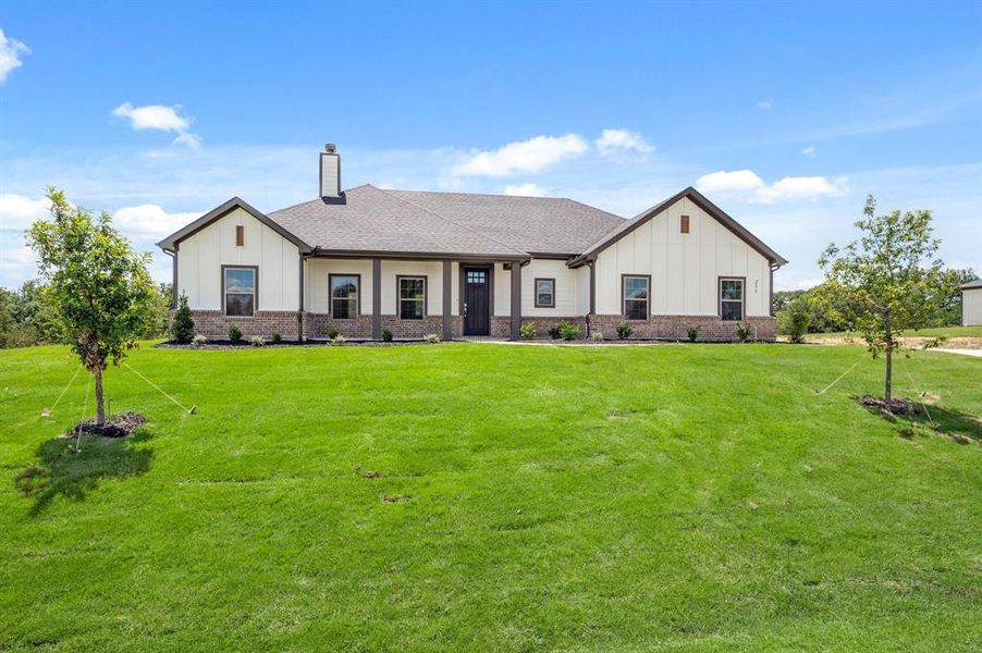 Front exterior of a new home in Saddleback Estates, Boyd, TX, highlighting curb appeal (Image 23).