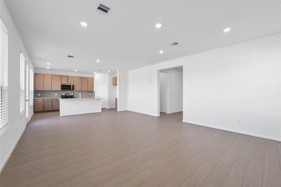 Stunning open-concept design seamlessly connecting the living, dining, and kitchen areas—perfect for both everyday living and entertaining! Stunning open-concept design seamlessly connecting the living, dining, and kitchen areas—perfect for both everyday living and entertaining!