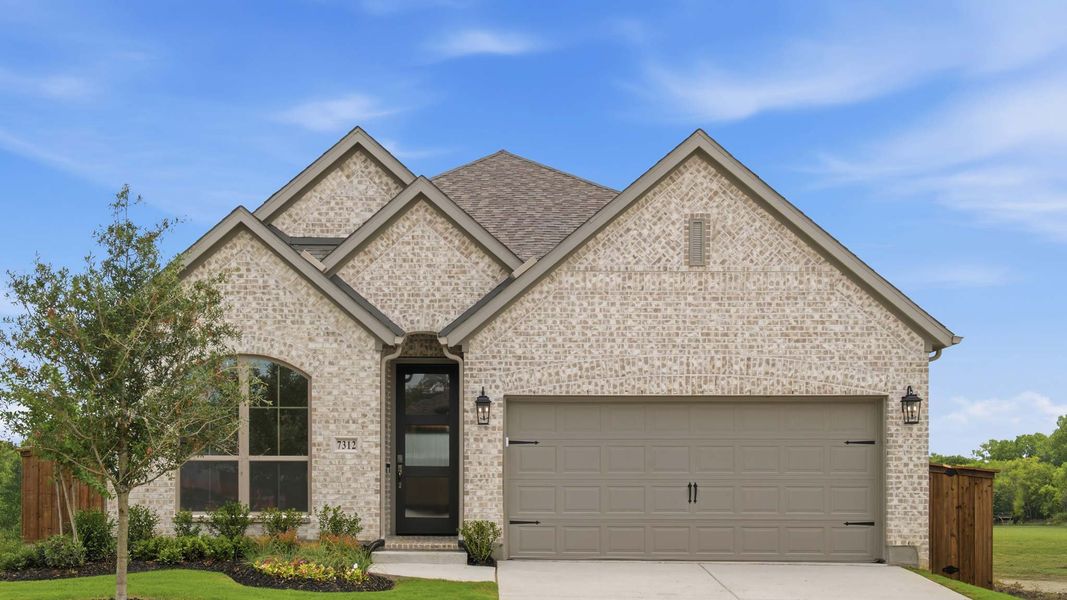 Front exterior of a new home in Trinity Falls, McKinney, TX, highlighting curb appeal (Image 1). Front exterior of a new home in Trinity Falls, McKinney, TX, highlighting curb appeal (Image 1).
